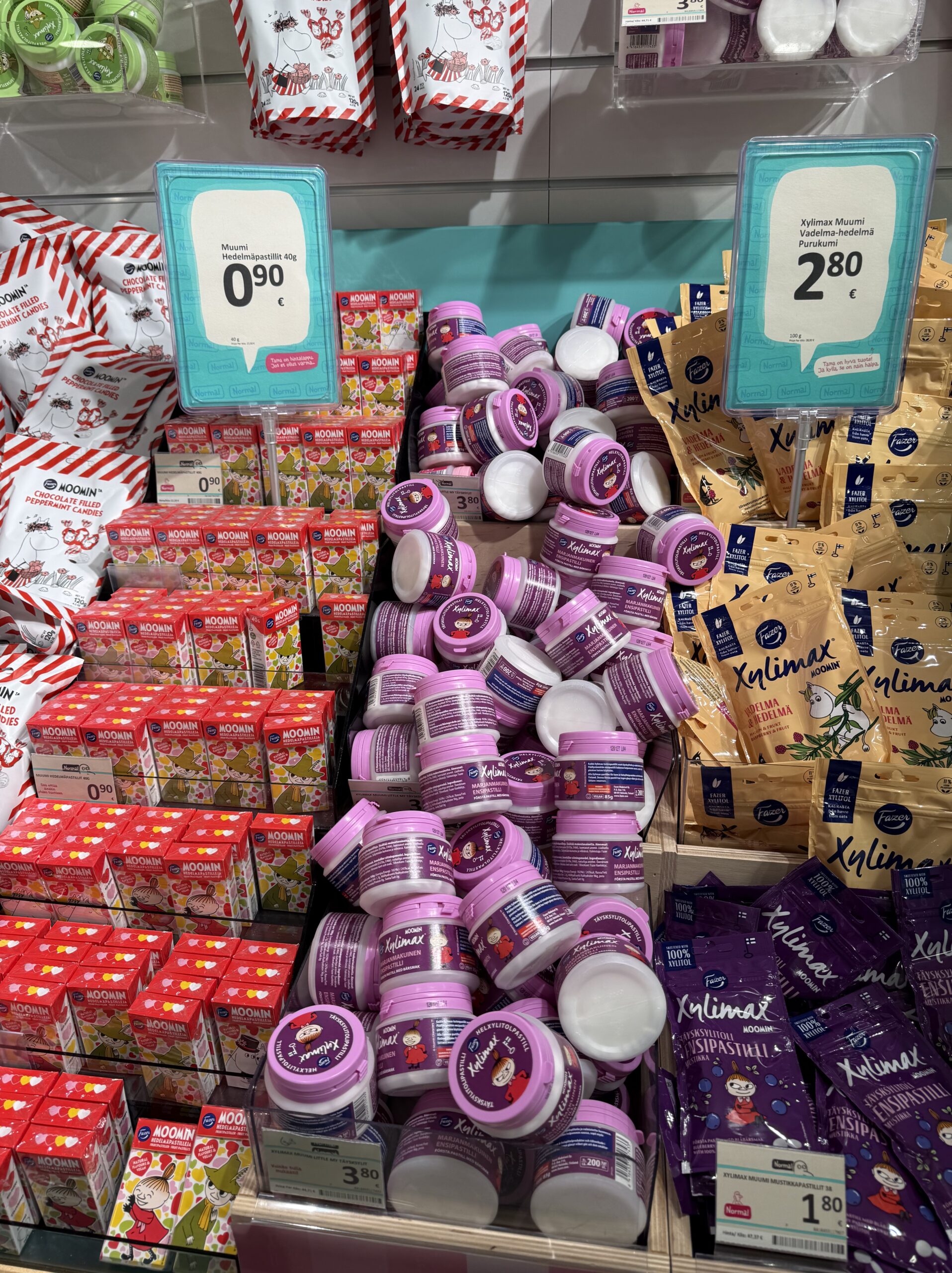 Mountains of pink Xylimax bottles featuring Little My