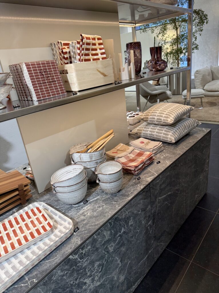 Store counter with Siena pattern trays and an Aalto vase