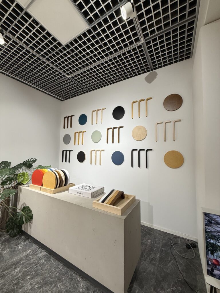 Wall display of colorful Stool 60 seats and L-legs
