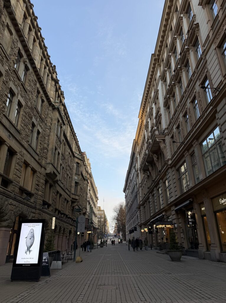 The historic stone facade of Fazer Cafe along Aleksanterinkatu