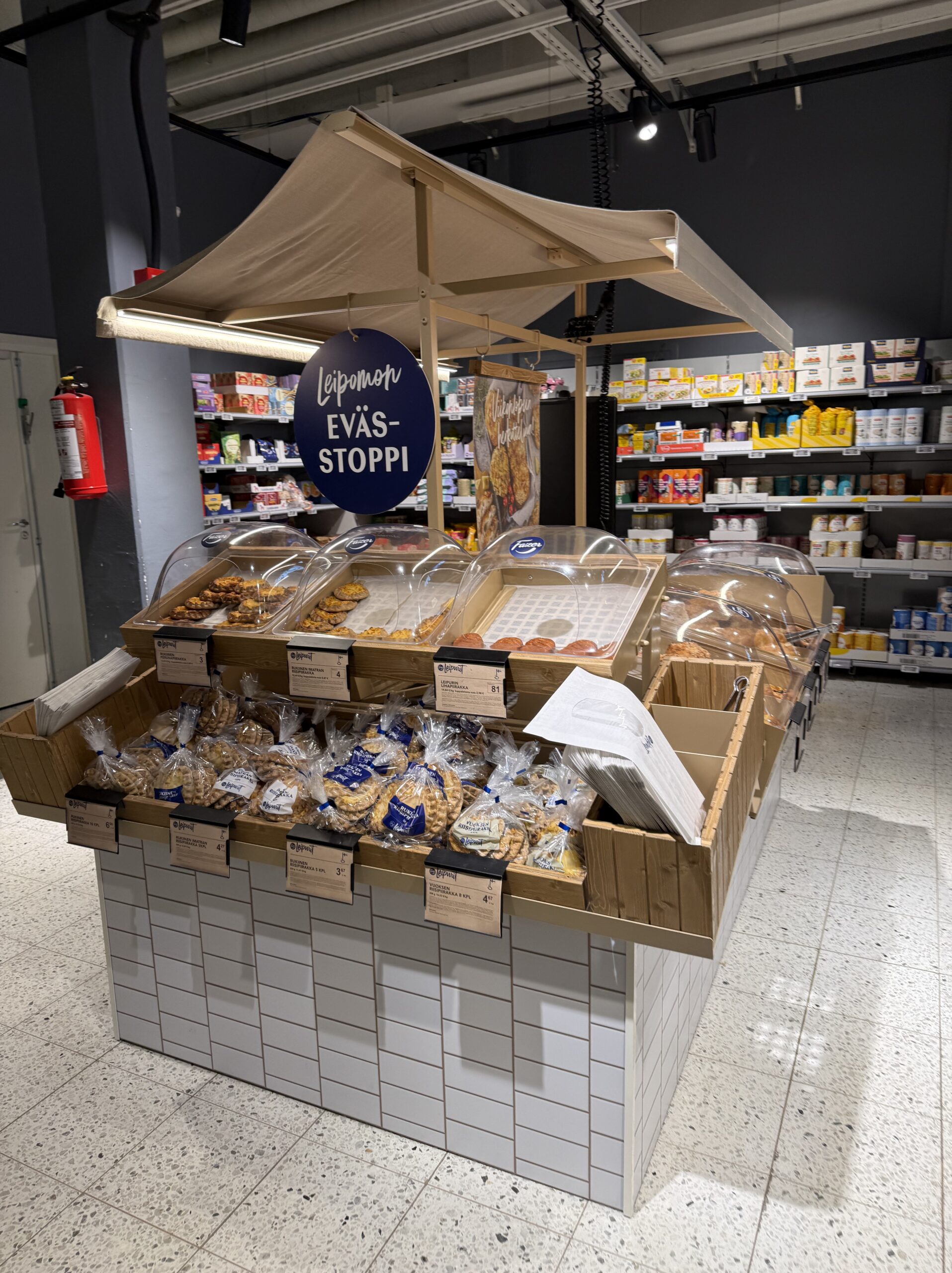 A wooden stall-like bread corner called EVÄS-STOPPI
