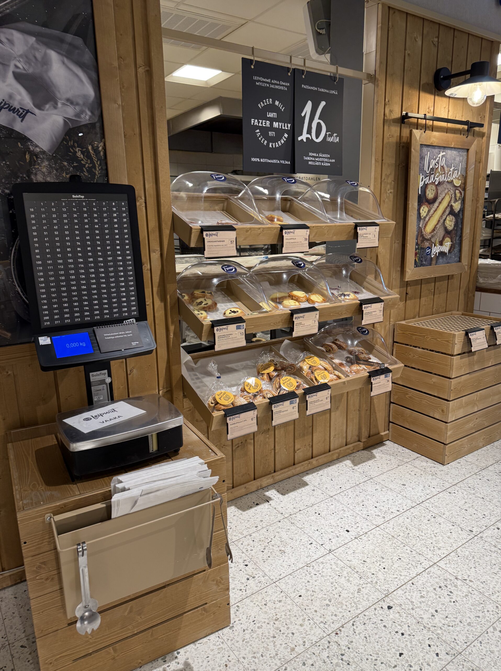 Freshly baked pastries displayed in transparent dome cases