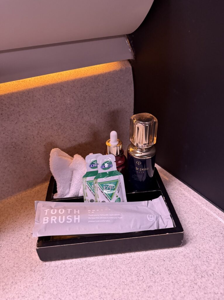 Cle de Peau Beaute skincare amenities arranged in the lavatory