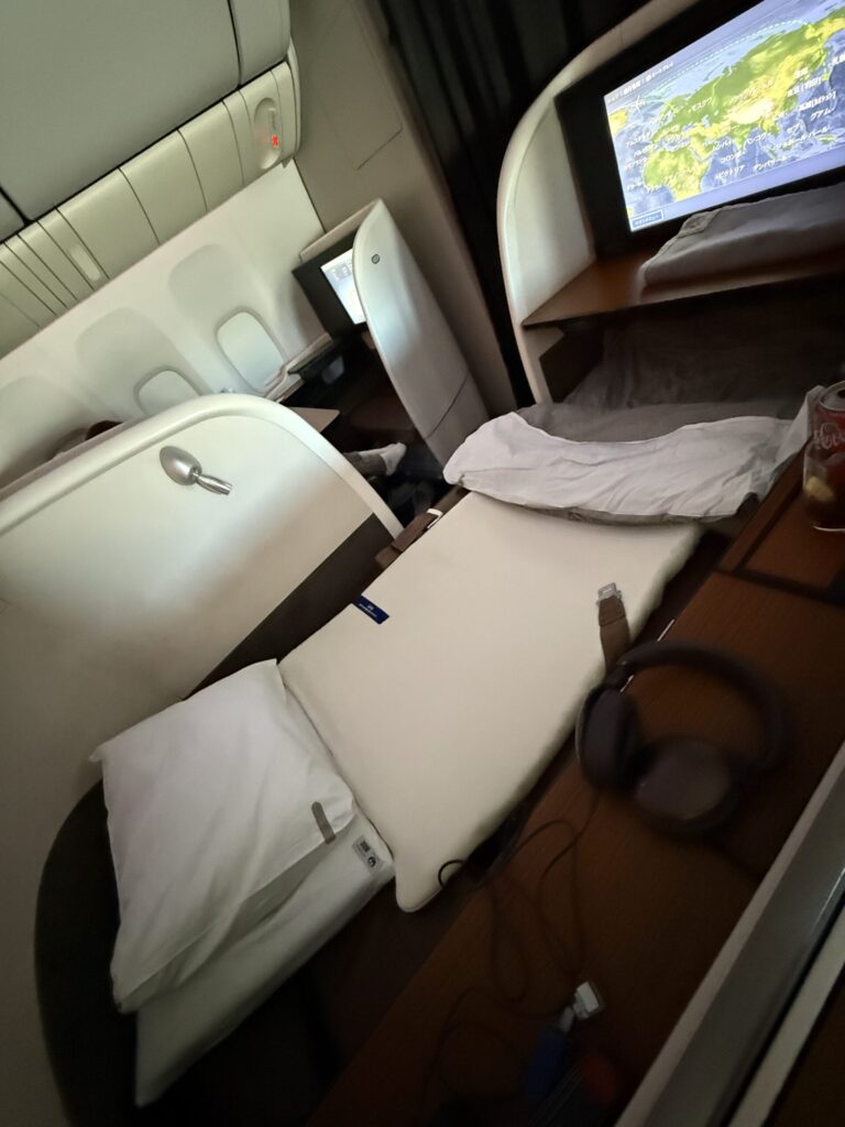 The First Class seat converted into a fully flat bed