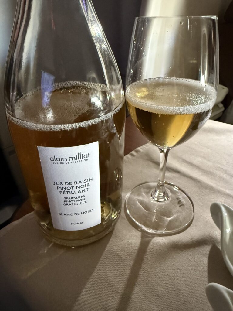 Alain Milliat sparkling grape juice in a glass