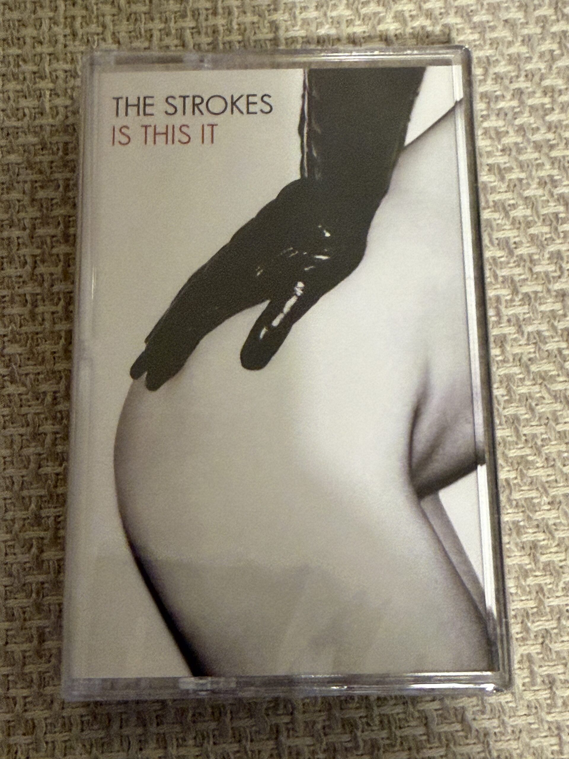 The Strokes 'Is This It' cassette tape on fabric.