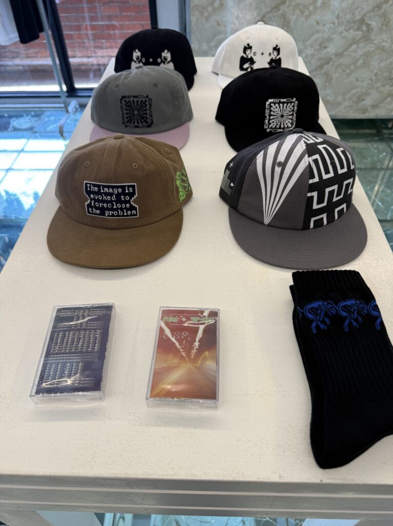 C.E cap with embroidered text and a limited edition cassette tape