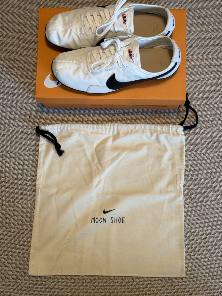 Nike Moon Shoe placed next to an exclusive canvas bag