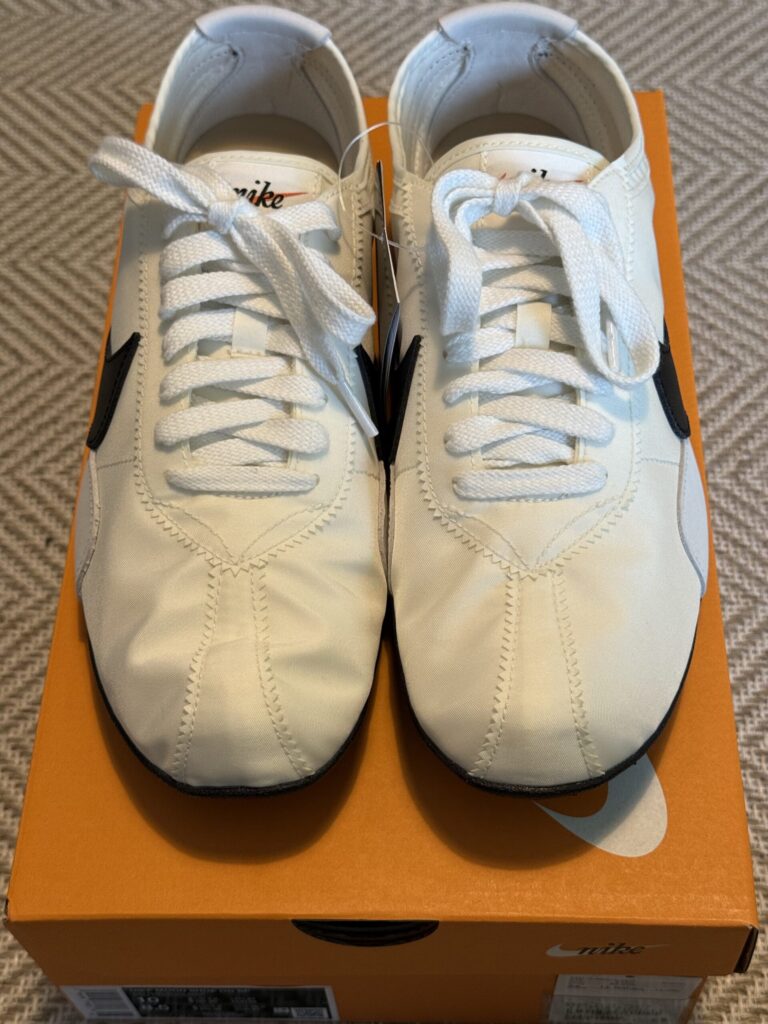 Nike Moon Shoe resting on its vintage orange box