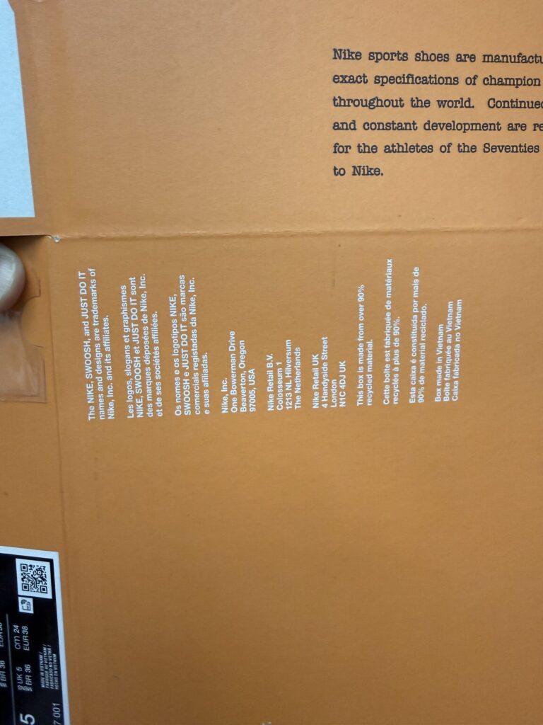 Back of the orange Nike shoebox featuring multilingual text