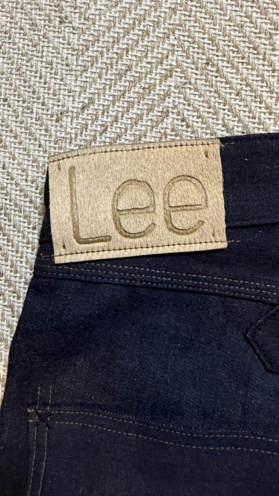Close up of the Lee hair-on-hide patch on stiff raw denim