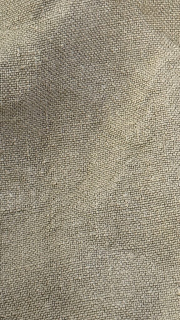 Full frame texture shot of faded grey hemp canvas