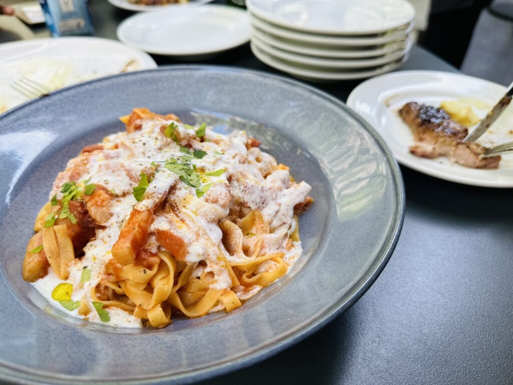 Tomato cream flat ribbon pasta with bacon