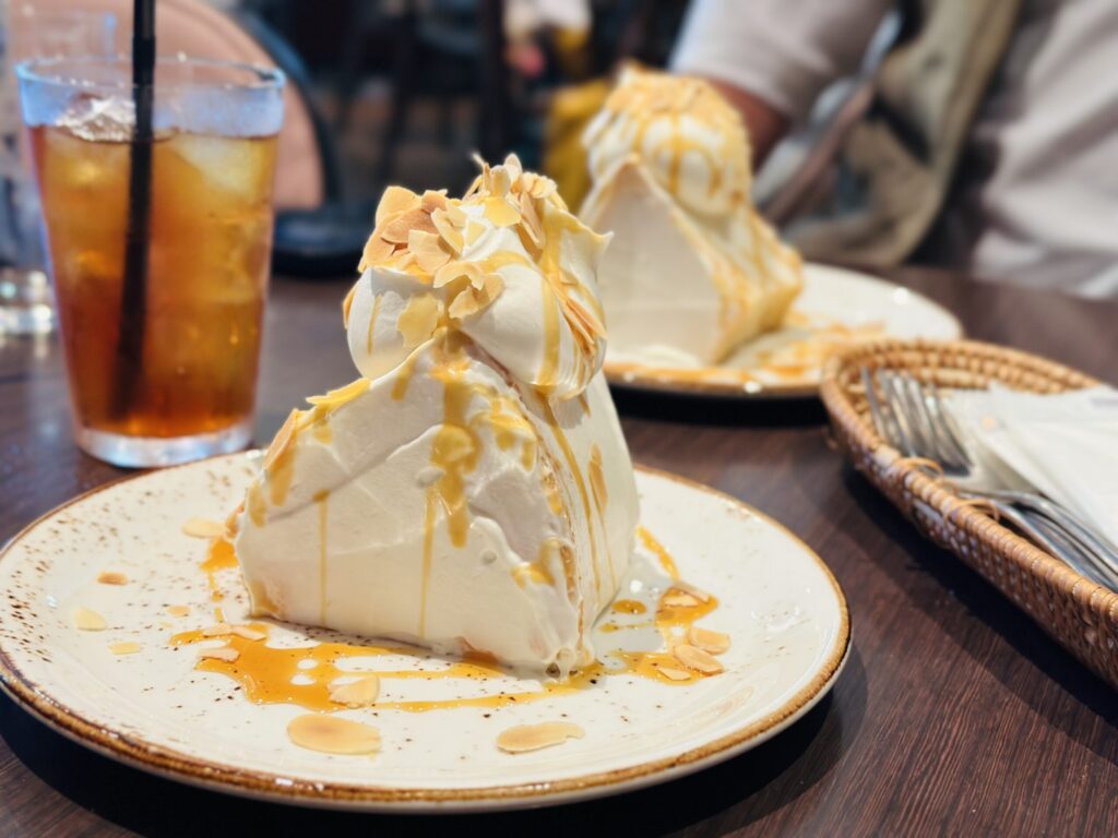 Angel food cake served with a glass of iced tea