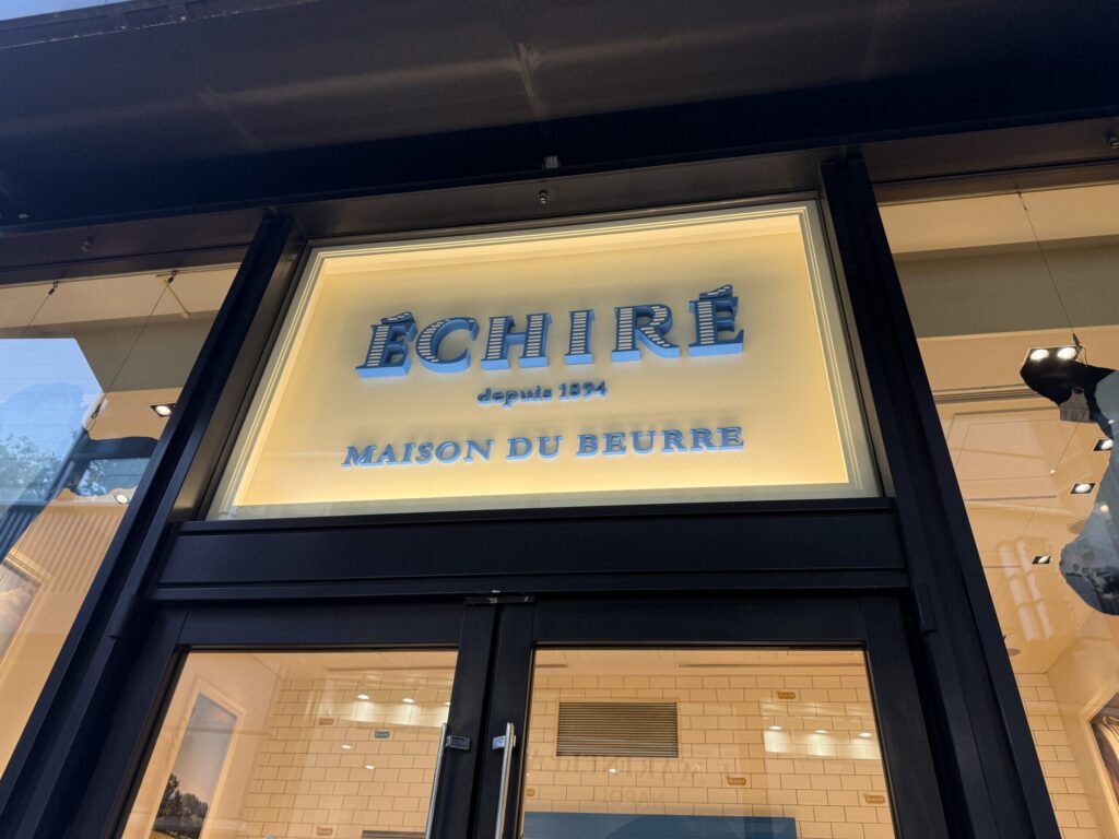 The cream-colored Echire signboard glowing softly outside the Marunouchi store