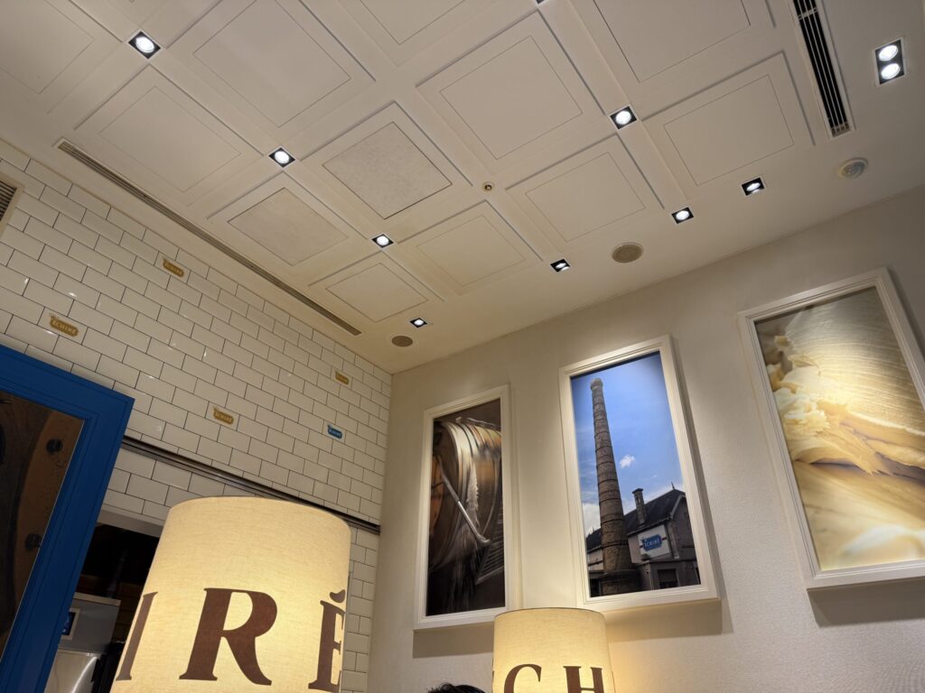 White subway tiles and a blue Echire logo plate inside the Marunouchi store