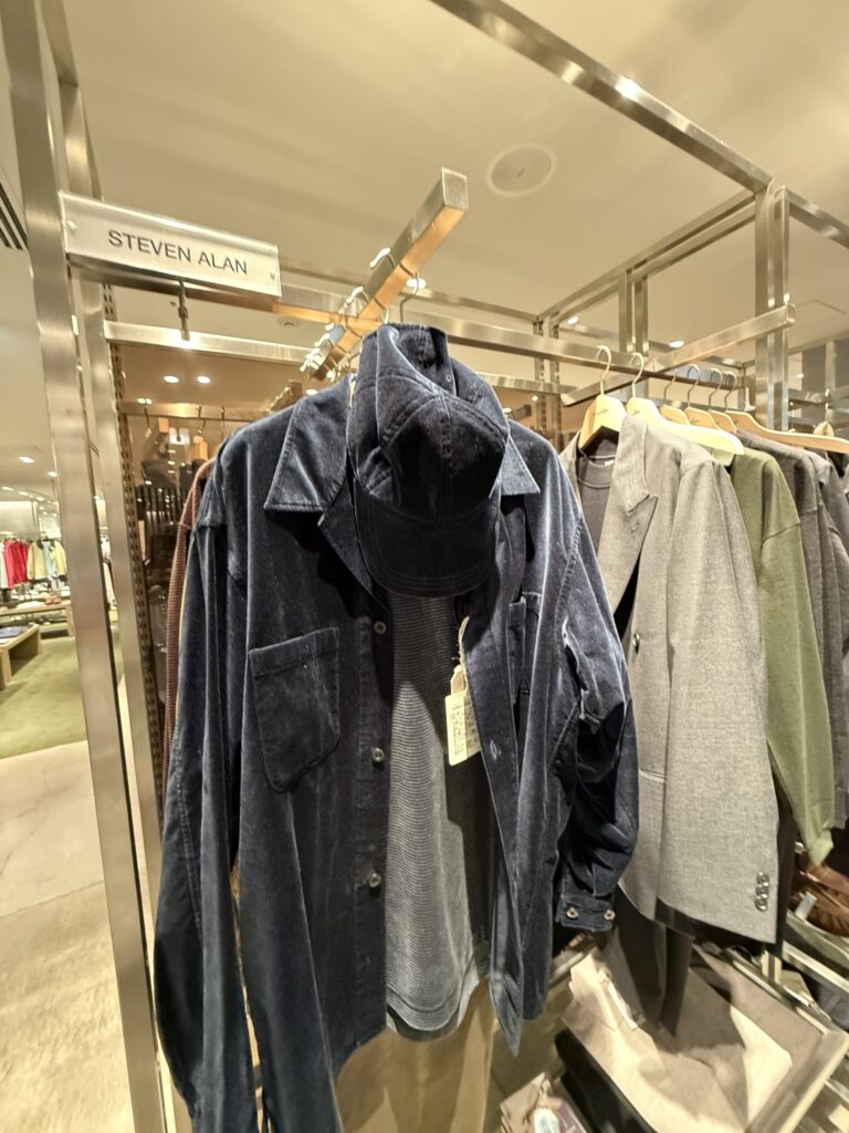 STEVEN ALAN navy corduroy jackets on a rack