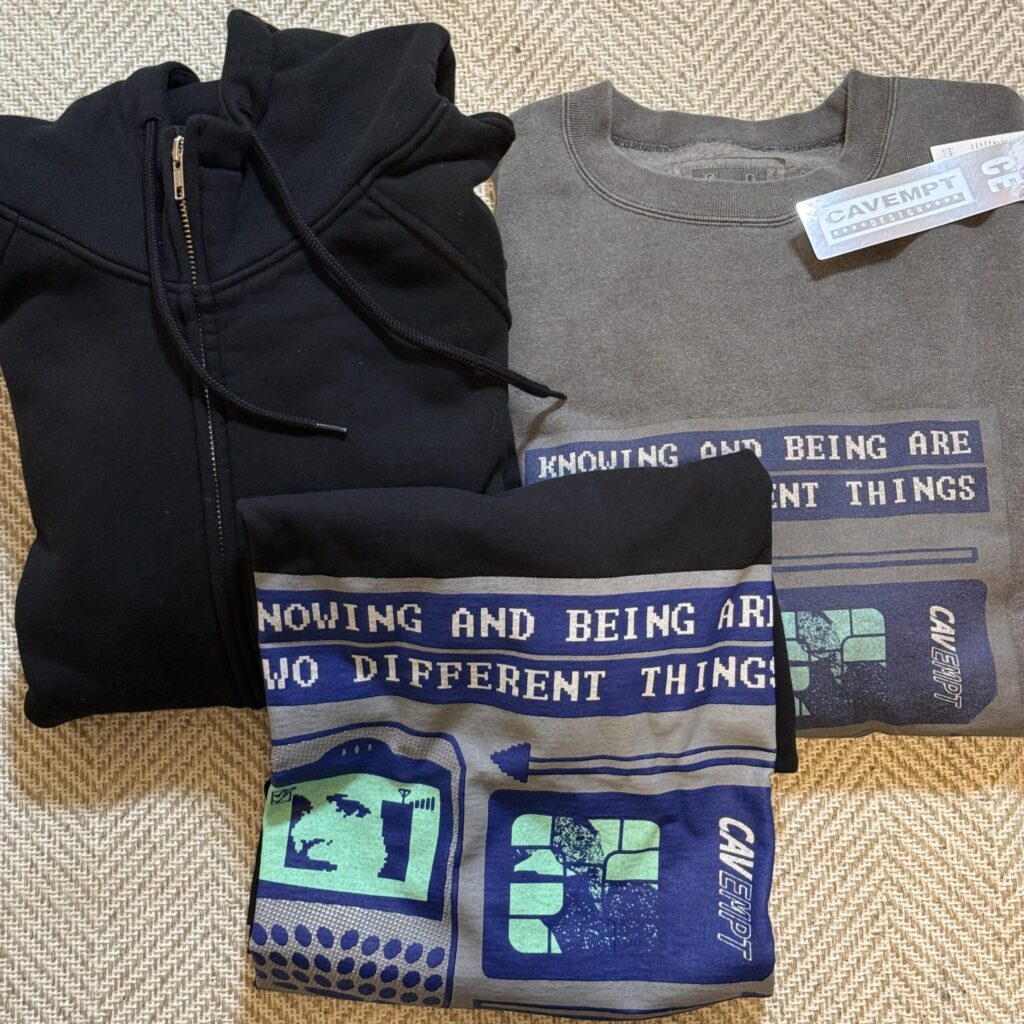 Three C.E collaboration items laid on a rug