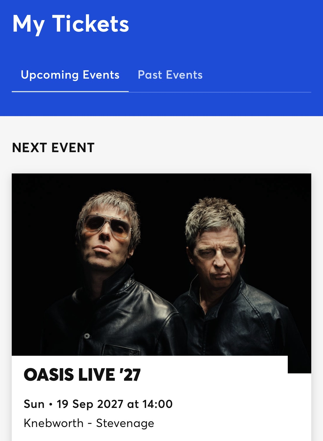 Ticketmasterの画面。Oasis Live '27のチケット情報と写真が表示されている。